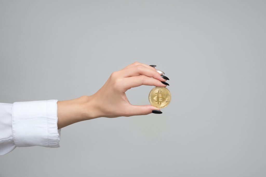 woman holding a bitcoin 1037912